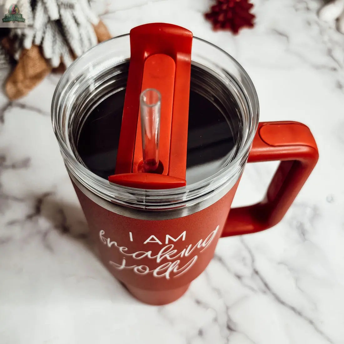 The Silent Night 40oz is a red insulated mug with a straw lid, perfect for keeping drinks hot or cold. A stylish and functional Christmas gift for anyone who loves both.