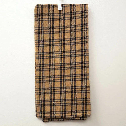 A Tan Kitchen Towel w/ Black Lines hangs neatly on a white hook against a plain light-colored wall.