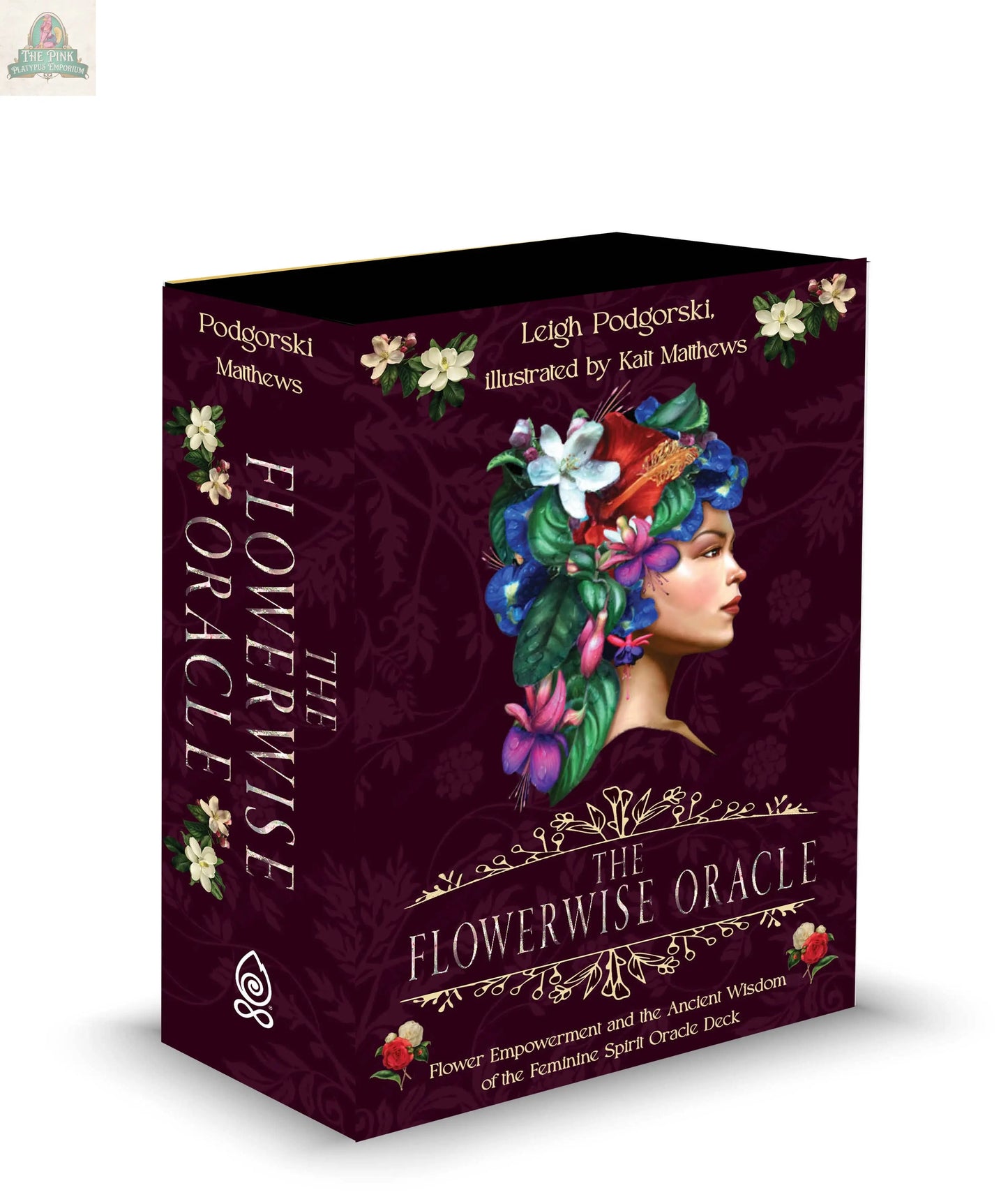 A box of The Flowerwise Oracle by REDFeather, featuring an illustrated woman with vibrant flowers and leaves in her hair on a dark purple background, with the title and authors' names in decorative gold and white text.
