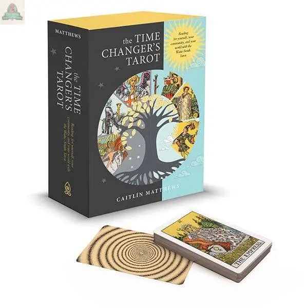 A box set called The Time Changer's Tarot by REDFeather is shown, featuring a tree design on the cover. In front are the tarot guidebook, card deck, and a single card displaying a spiral pattern.