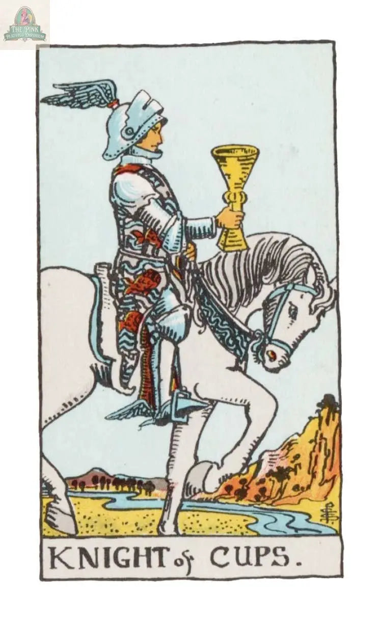 A knight in armor on a white horse holds a golden cup upright as he rides past a blue river and yellow hills beneath a clear sky. Inspired by the Waite-Smith Tarot, The Time Changer's Tarot by REDFeather reads KNIGHT of CUPS at the bottom.