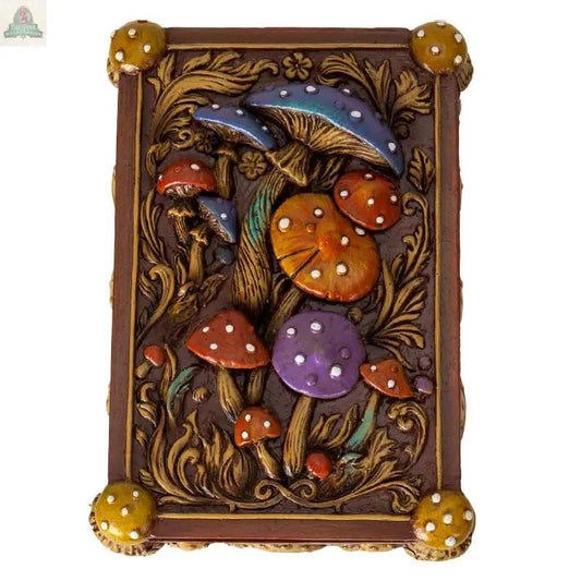 The Toadstool Mushroom Tarot Box is a decorative resin box with embossed red, orange, purple, and yellow mushrooms plus ornate gold leafy designs—perfect for tarot collectors or spiritual practitioners.
