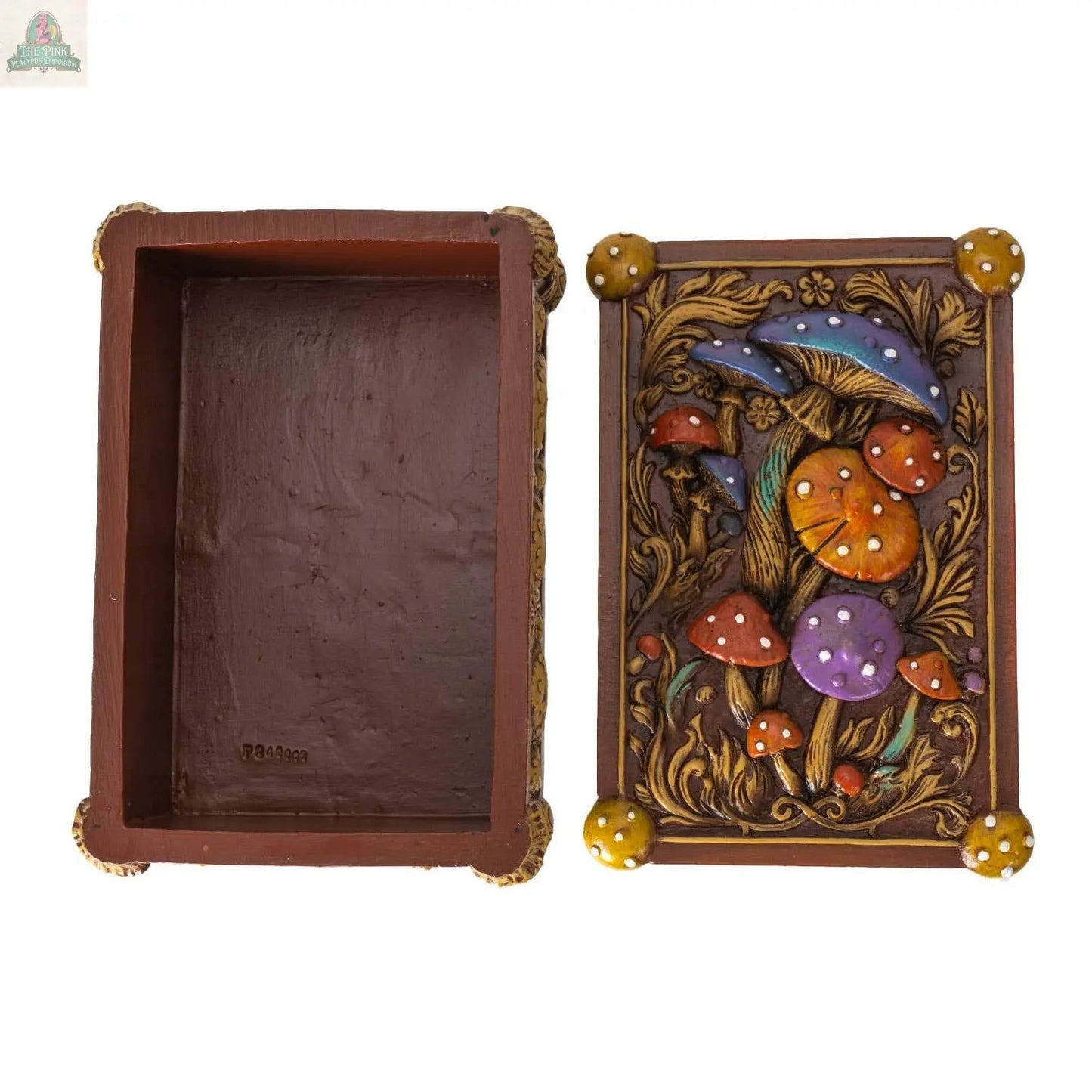 The Toadstool Mushroom Tarot Box is a rectangular brown resin box with its lid removed, revealing an empty interior. The lid features colorful mushrooms and leaves—ideal for tarot collectors.