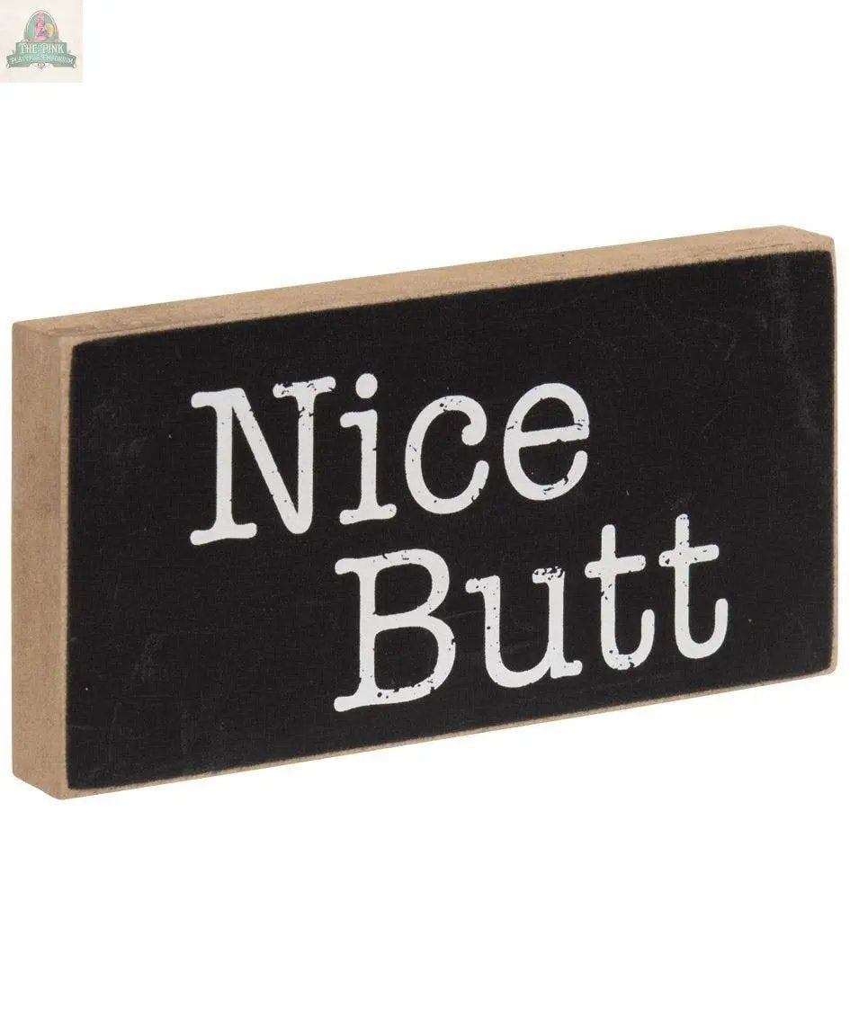 The Toilet Block Sign Assorted/2 features a rectangular rustic wood design with a black front and white “Nice Butt” text—ideal as humorous bathroom decor or a playful toilet block sign.