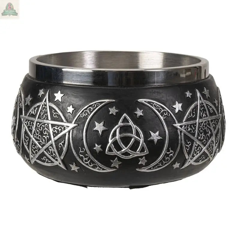 The Triple Moon Resin Smudge Ritual Offering Bowl features a black base with silver pentagrams, crescent moons, stars, and a triquetra. Its ornate metallic rim and mystical design make it ideal as an offering bowl for spiritual rituals.