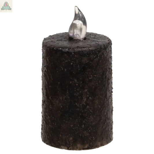 The Warm Glow Textured Black Flicker Flame Timer Pillar, 3", is a flameless LED candle with a realistic flicker flame, standing tall against a white background for effortless ambiance.