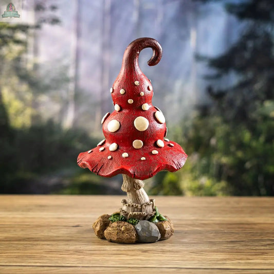 The Whimsical Toadstool Mushroom Home and Garden Decor features a red toadstool statue with white spots and a tall, twisted cap, perfect for adding cottagecore charm to your garden or home.