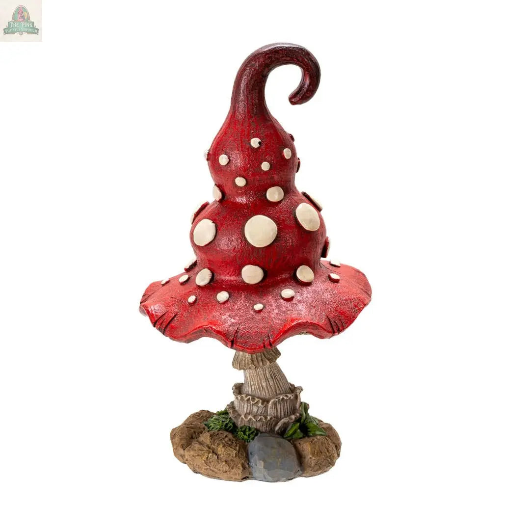The Whimsical Toadstool Mushroom Home and Garden Decor features a tall red spiral cap with white spots on a rocky, moss-accented base—ideal cottagecore decor for anyone who loves unique mushroom statues.