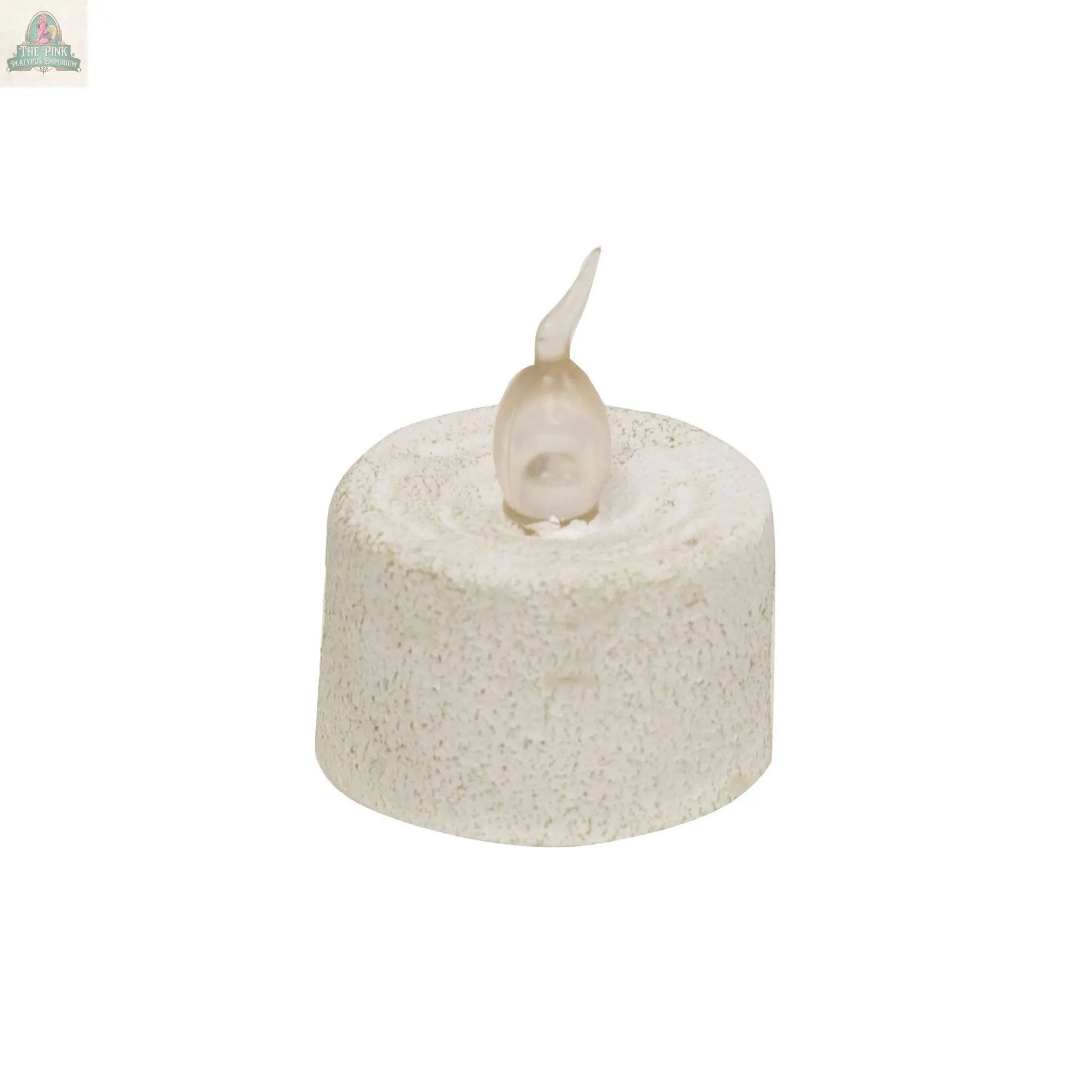 The White Cement Timer Votive is a small, round, battery-operated candle with a textured white cement surface and a translucent flame tip, featuring automatic shut-off for effortless, worry-free ambiance.