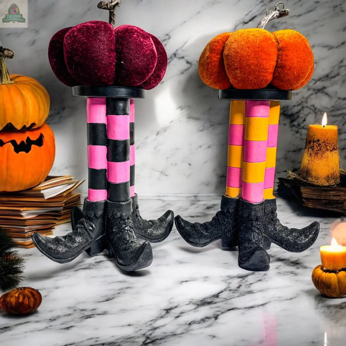 The Wicked Witch Candle Holder features two whimsical witch legs with curled shoes, striped stockings, and pumpkin tops—ideal as a playful Halloween centerpiece or to add a charming touch to your seasonal decor.