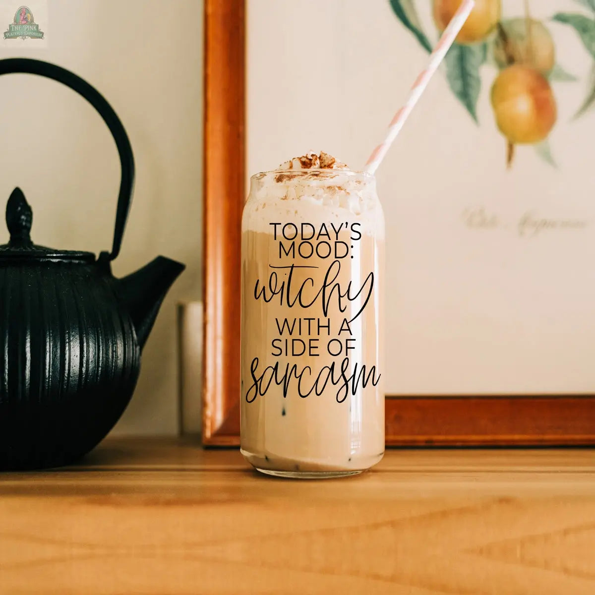 Enjoy your iced coffee in the Witchy 20oz glass tumbler, topped with whipped cream and cinnamon and paired with a striped straw. Featuring the phrase "Today’s mood: witchy with a side of sarcasm," it’s the perfect gift for coffee-loving witches!.