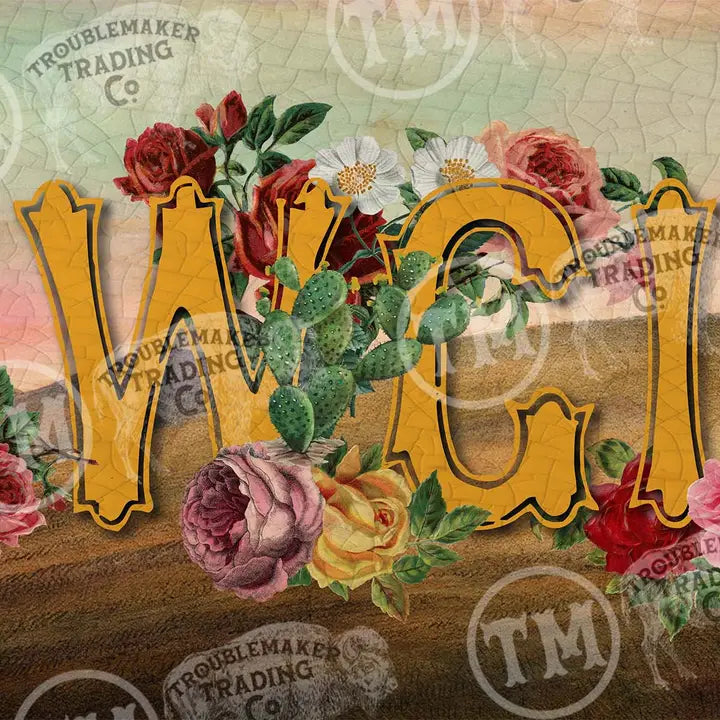 western wall art design closeup with floral elements and 'COWGIRL' text on a textured background.