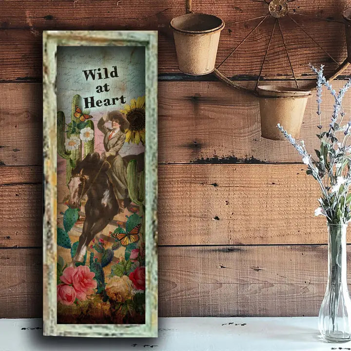 western wall art with 'Wild at Heart' text on a wooden background