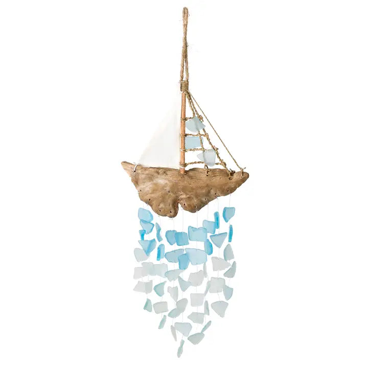 Decorative wind chime sailboat made of driftwood and sea glass on a white background