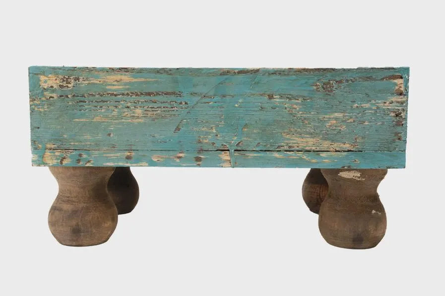 Rustic wooden planter box with a distressed blue top and brown legs on a white background