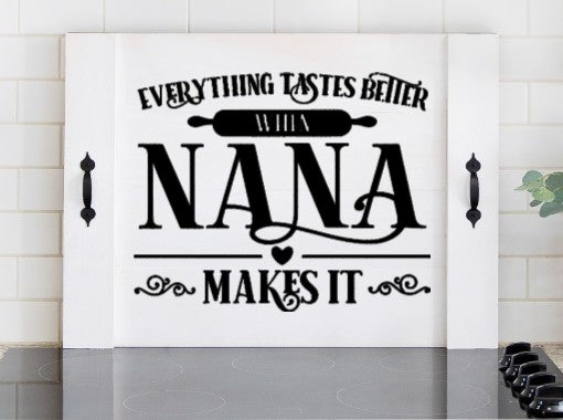 Pink Platypus Emporium Nana stove cover featuring Everything Tastes Better When Nana Makes It on a solid wood farmhouse noodle board.