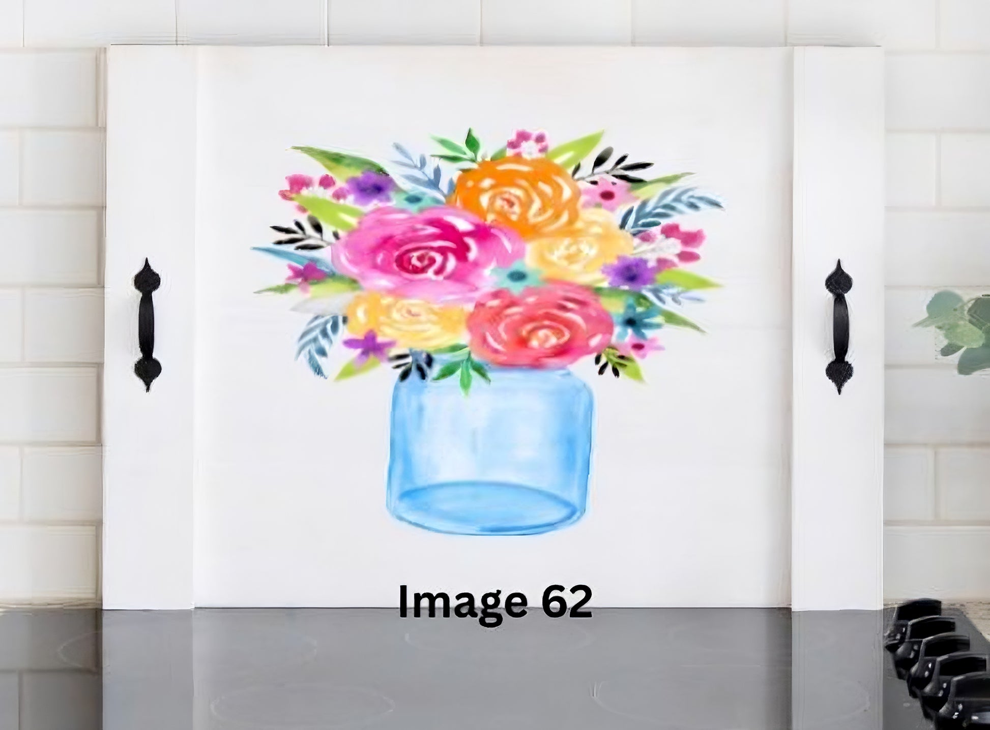 Pink Platypus Emporium colorful floral stove cover with pink, orange and yellow flowers in a blue mason jar on a solid wood farmhouse noodle board.