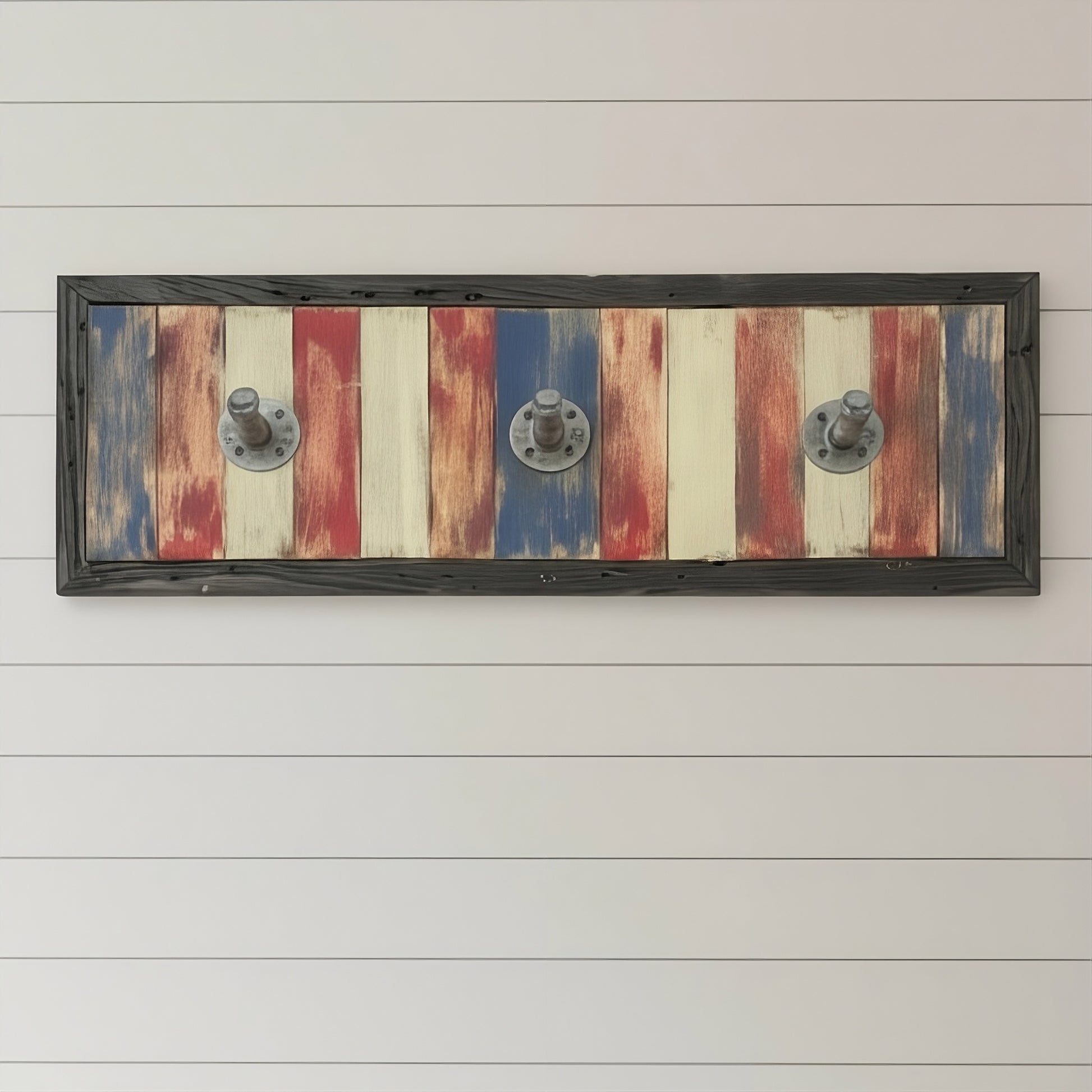 americana Wooden wall art/coat rack with a striped design and metal fixtures on a white wooden panel background