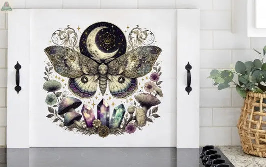 stove cover with metaphysical moth and crystals