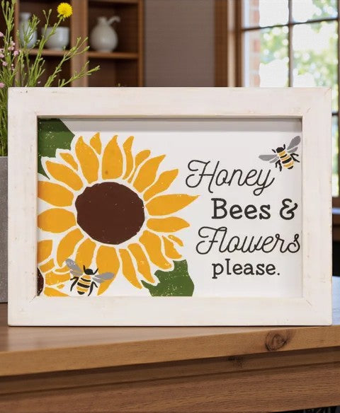 Decorative sign with sunflower and bees on a wooden surface