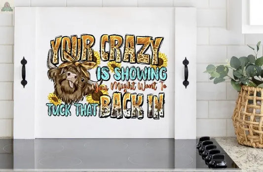 stove cover with a cow saying your crazy is showing. Pink Platypus Emporium